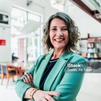 Portrait of mature woman at library